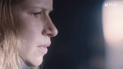 Close Up Of Woman With Netflix Logo GIF