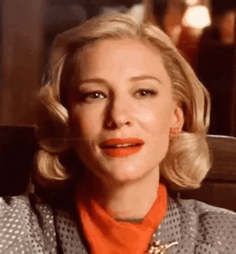 Close Up Of Woman With Red Lipstick And Gray Jacket GIF