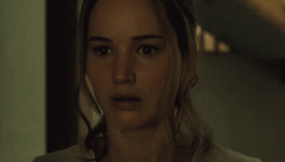 Close Up Of Woman With Serious Look In Dark Room GIF