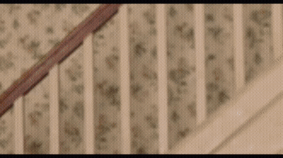 Close Up Of Wooden Staircase Railing GIF