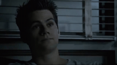 Close Up Of Young Man's Face In Front Of Window With Blinds GIF