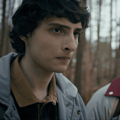 Close Up Of Young Man's Face In Gray Jacket GIF