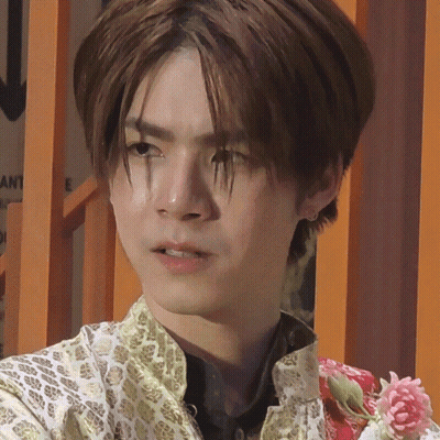 Close Up Of Young Man With Flower GIF