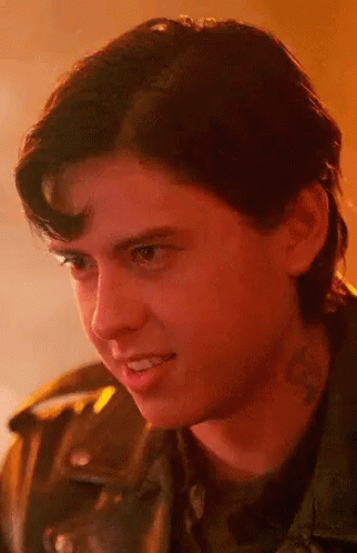 Close Up Of Young Man With Neck Tattoo And Leather Jacket GIF