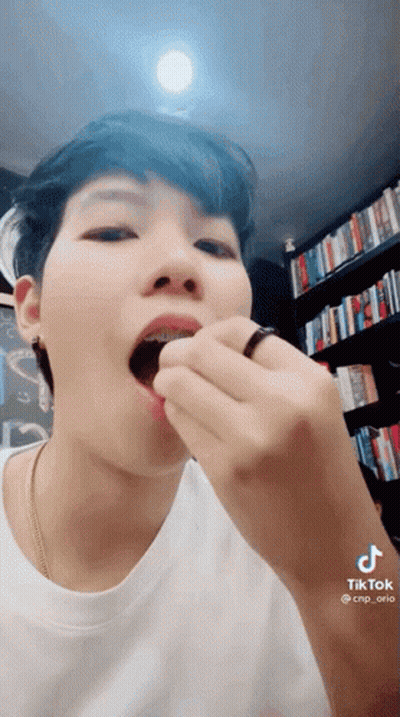 Close-Up Person Eating With Ring In Mouth GIF