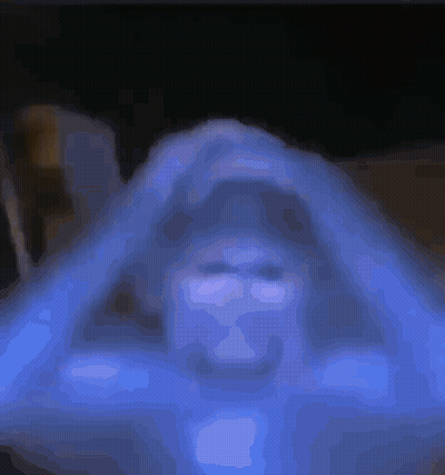 Close Up Person Face Dark Room Blue Background GIF