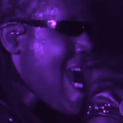 Close Up Person Face Purple Lights Behind GIF