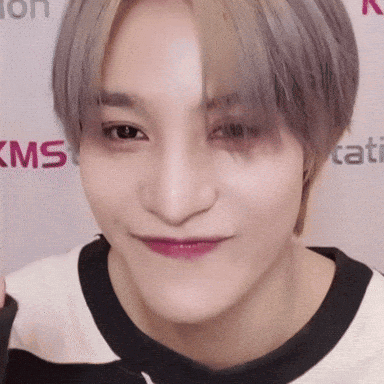 Close Up Person Face With KMS Logo GIF