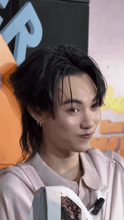 Close Up Person Face With Letter R Behind GIF