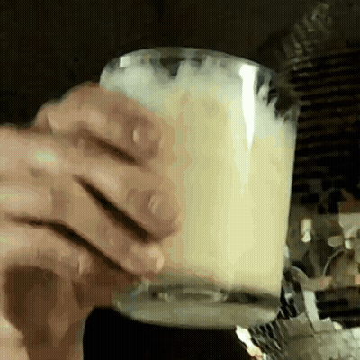 Close Up Person Holding Cup Of Milk GIF