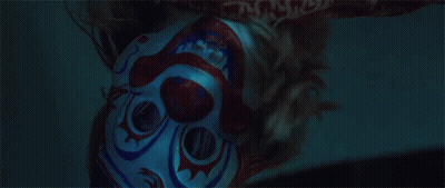 Close Up Person In Clown Mask In Dark GIF