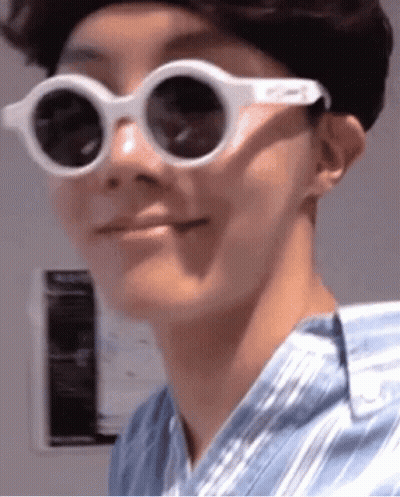 Close Up Person In Sunglasses Making Funny Face GIF
