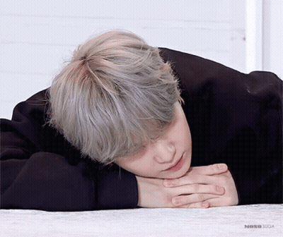 Close Up Person Laying On Floor Head On Hands Saying No GIF