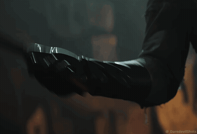 Close Up Person's Arm With Daredevil Shots GIF