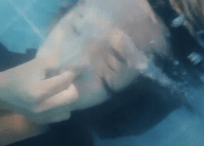 Close Up Person's Face Underwater GIF