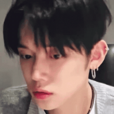Close-Up Person's Face With Earrings And Necklace GIF