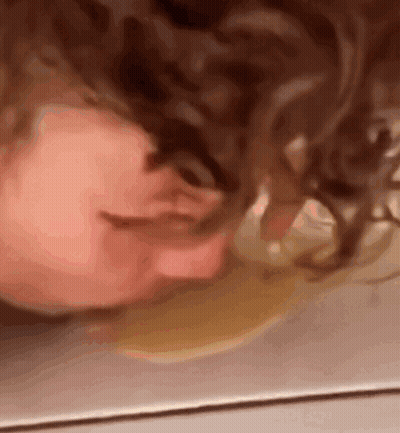 Close Up Person's Head On Floor GIF