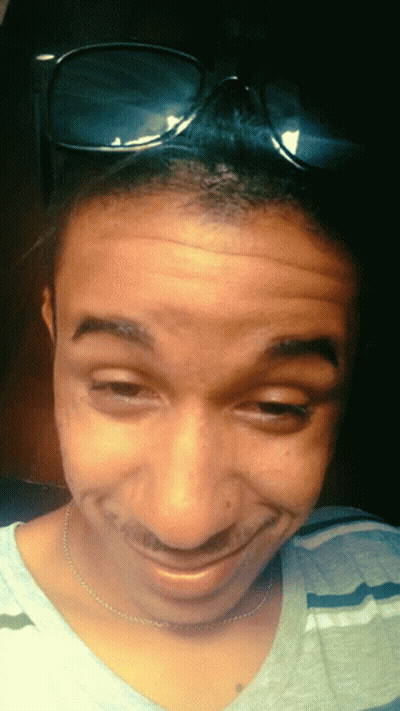 Close Up Person Smiling With Pink Eyes GIF