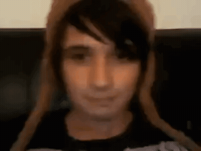Close Up Person Wearing Hat And Black Shirt GIF