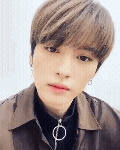 Close Up Person With Brown Jacket And Earrings GIF
