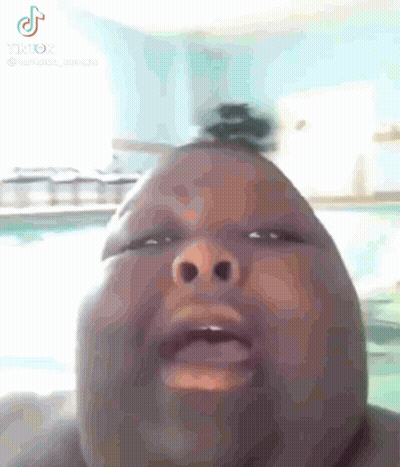 Close-Up Person With Bun On Head Next To Pool GIF