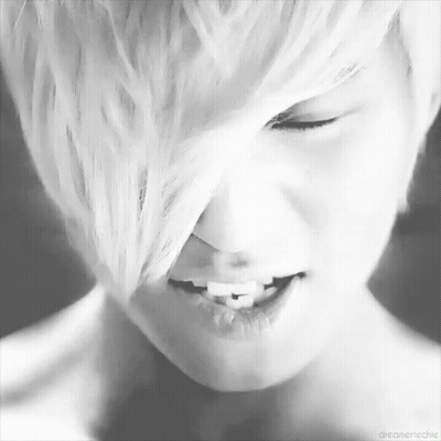 Close Up Person With Eyes Closed And White Hair GIF