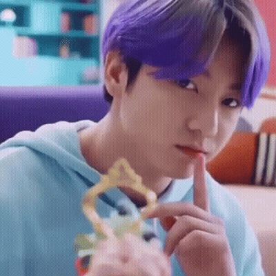 Close Up Person With Purple Hair Holding Trophy GIF