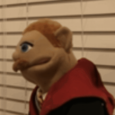 Close Up Puppet With Red Hair And Mustache GIF