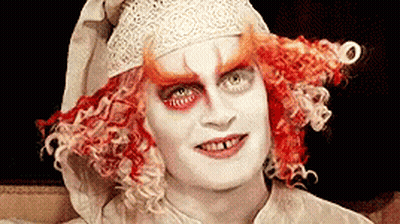 Close Up Red Hair White Face Paint GIF