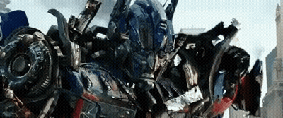 Close Up Robot With Helmet In Front Of City GIF