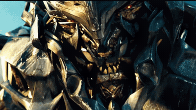 Close Up Robot With Red Eyes And Sharp Teeth GIF