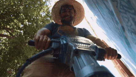Close Up Shot Of Man Using Jackhammer GIF