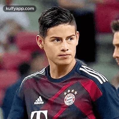 Close Up Soccer Player In Blue And Red Jersey GIF