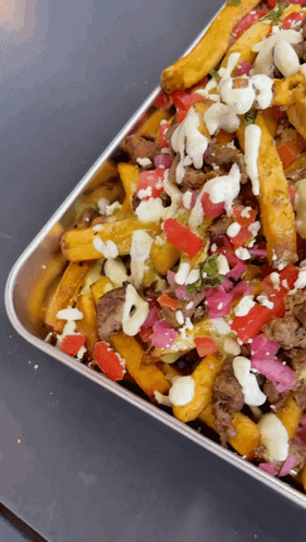 Close Up Tray Of Food With Toppings GIF