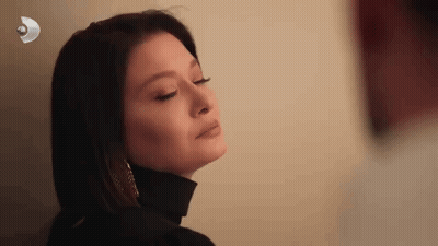 Close-Up Woman Eyes Closed Black Turtleneck Earrings GIF