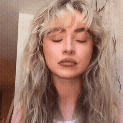 Close-Up Woman Eyes Closed Hair Blowing GIF