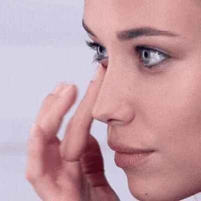 Close Up Woman Finger On Nose GIF