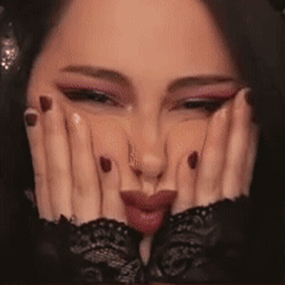 Close Up Woman Making Face With Hands On Face GIF