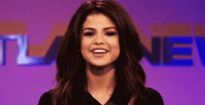 Close Up Woman Purple Background Saying New GIF