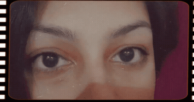 Close Up Woman's Eyes In Film Strip Frame GIF