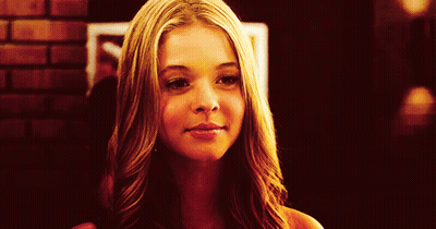 Close Up Woman's Face Brick Wall GIF