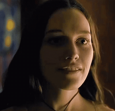 Close Up Woman's Face Dark Room GIF