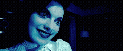 Close Up Woman's Face In Dark GIF
