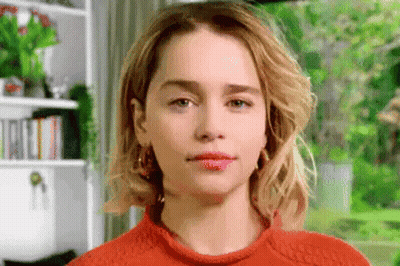 Close Up Woman's Face In Orange Sweater GIF