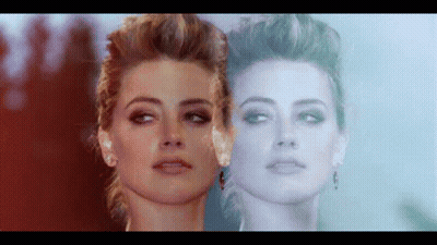Close Up Woman's Face Reflecting Another's Face GIF