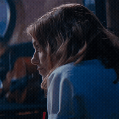 Close Up Woman's Face With Blue Light GIF