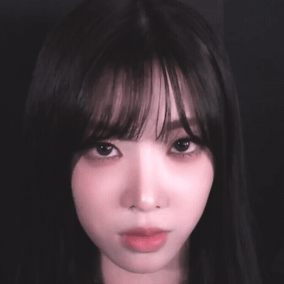 Close Up Woman's Face With Dark Hair GIF