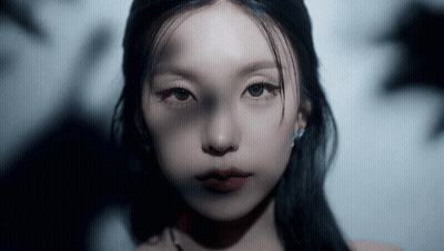 Close Up Woman's Face With Dark Hair GIF