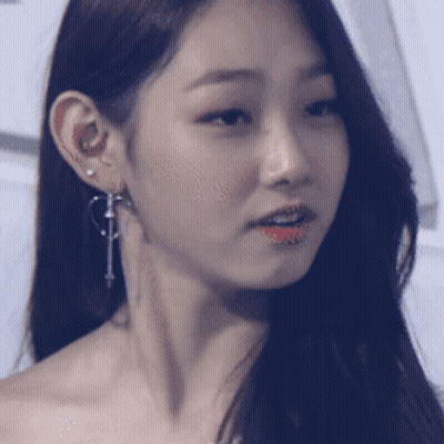 Close Up Woman's Face With Earrings GIF