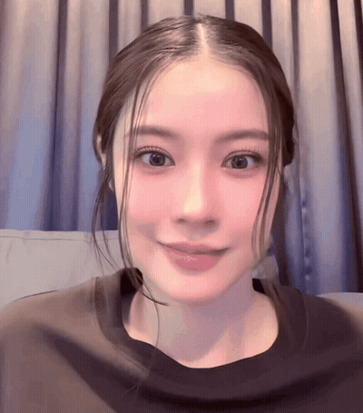 Close Up Woman's Face With Pink Curtain GIF